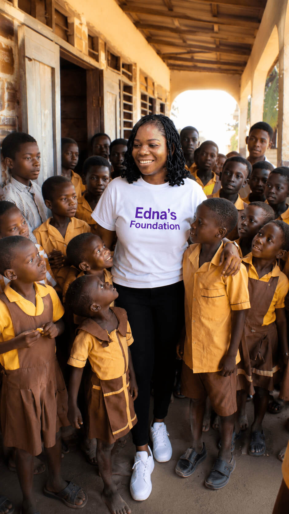 Edna's Foundation founder with schoolchildren